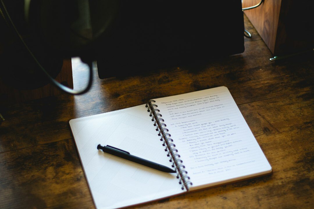 writer at desk with notebook