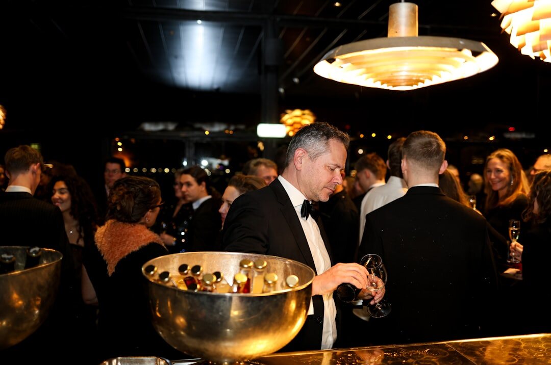 Uruguayan socialite laughing at a glamorous cocktail event